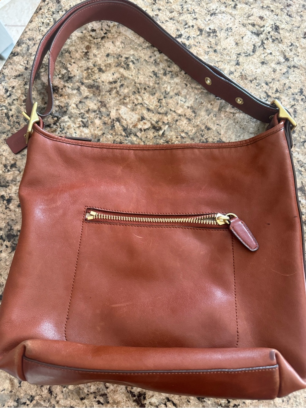 brown leather Coach Legacy Duffle hobo bag featuring brass hardware - Picture 2 of 3